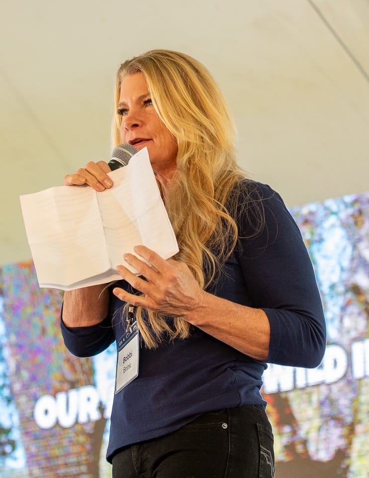 Founder-of-Lions-Tigers-and-Bears-Bobbi-Brink-giving-her-speech-at-2025-Wild-in-the-Country-fundraiser-event
